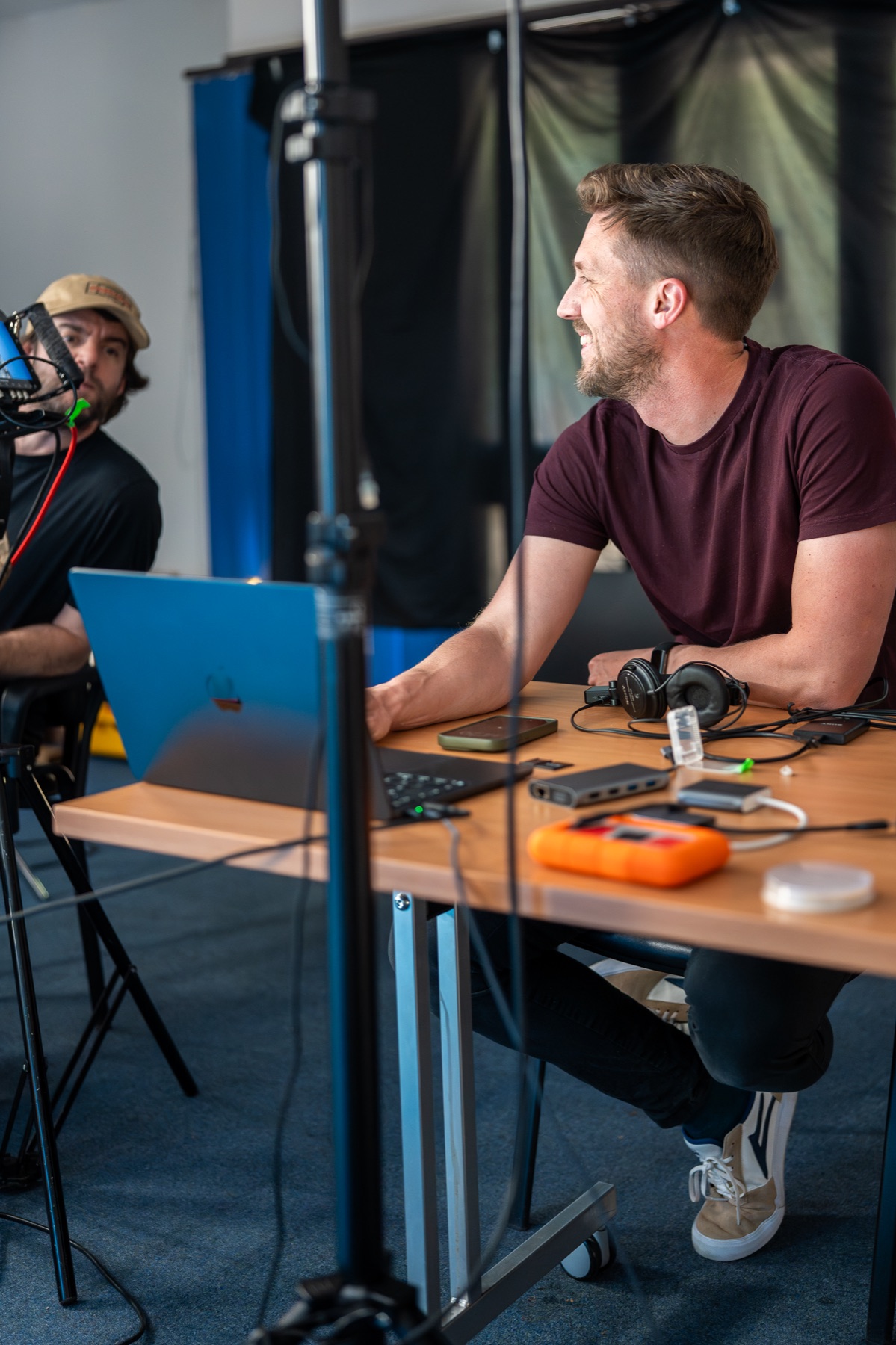 Lewis and a collaborator reviewing material during a shoot